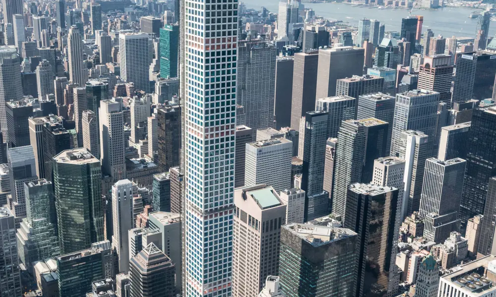 432 Park Avenue skyscraper towering above New York city's skyline. 