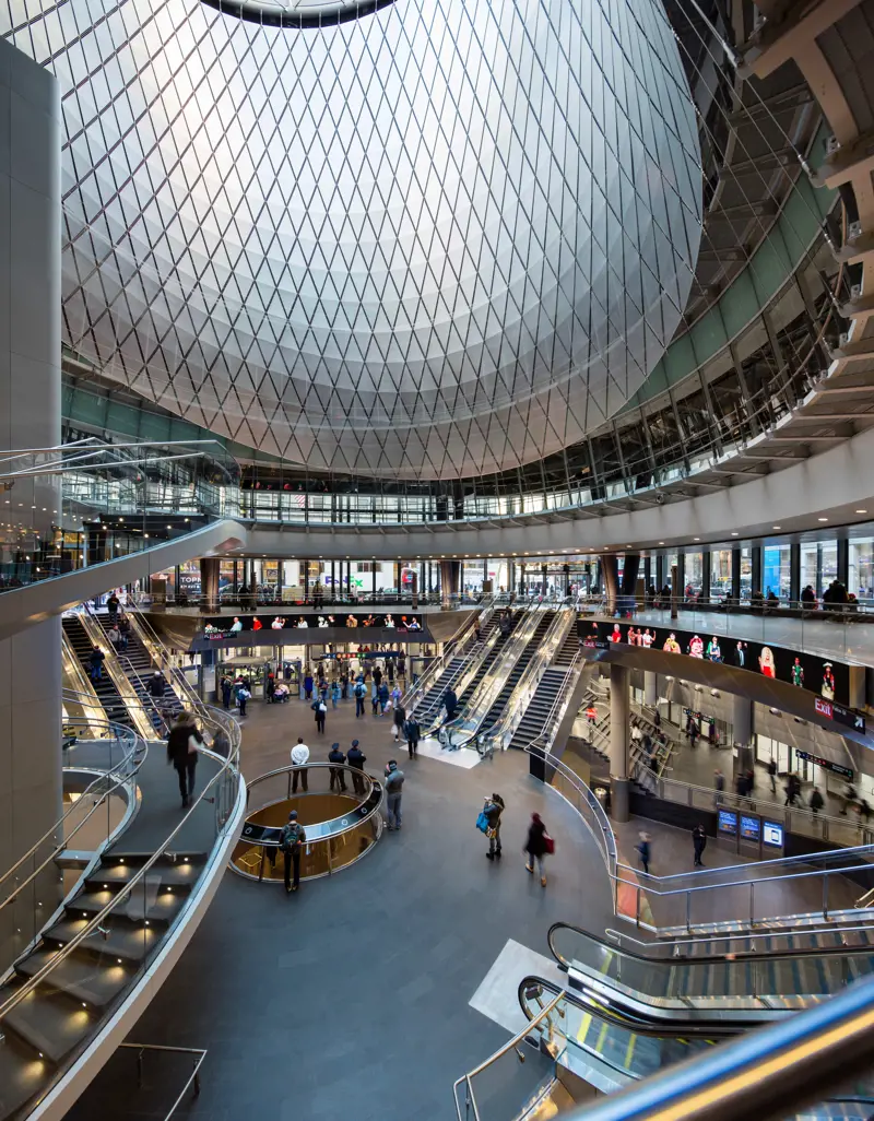 The inside of the Fulton Center, showing the dome in the roof.