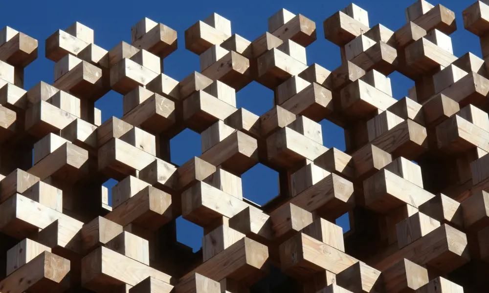 A structure of wooden blocks placed on top of each other. 