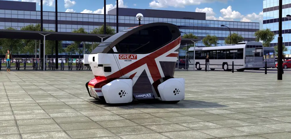 The two-seater electric car with luggage space known as the Lutz pod on a pavement. 
