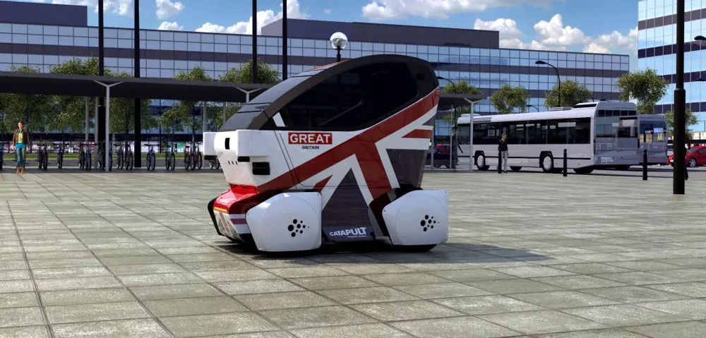 The two-seater electric car with luggage space known as the Lutz pod on a pavement.