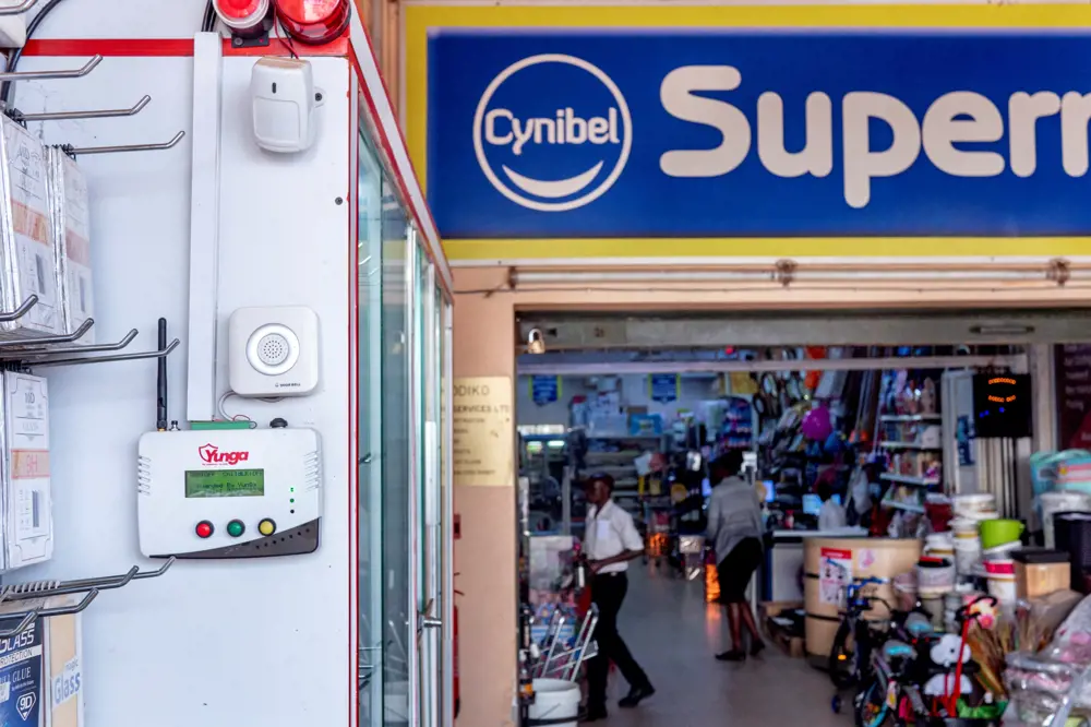 A security system affixed to a wall at a supermarket in Uganda.