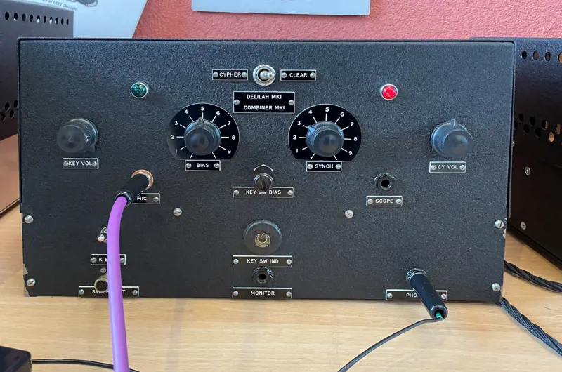 A close up of the front panel of an encryption device built by Alan Turing, with knobs and wires protruding from it.