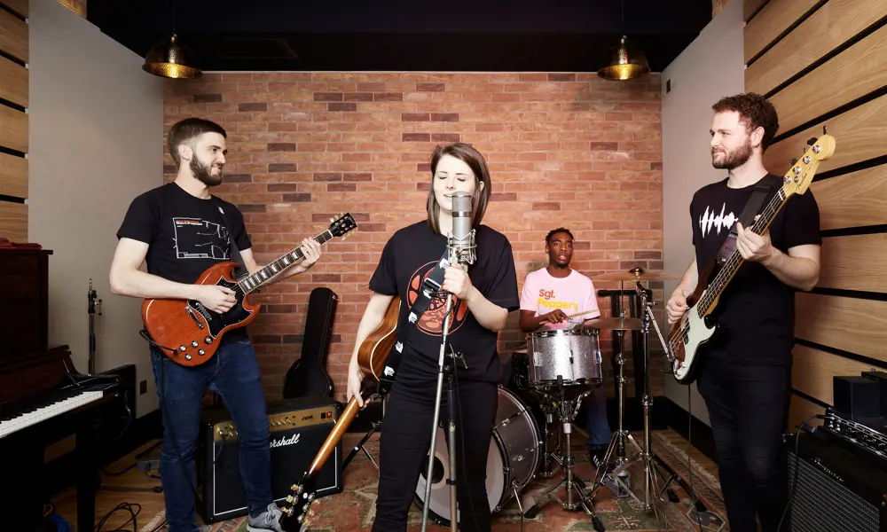 A band performing in a studio. 