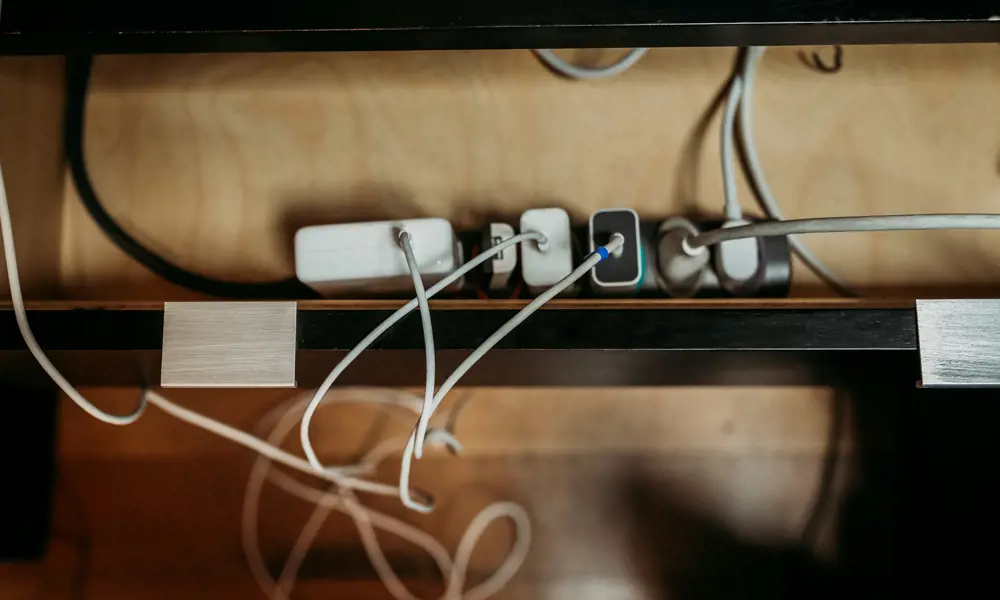 A group of chords plugged in to an adaptor. 