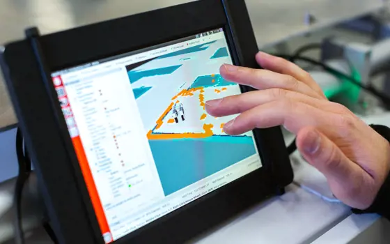 A tablet device shows data modelling onscreen, with a hand shown exploring the data by touching the screen 