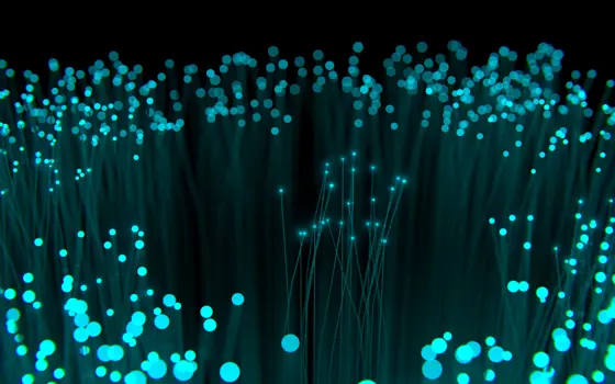 A artistic representation of a collection of optical fibres with light being transported to the end of the fibre. 