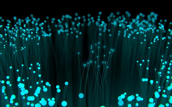 A artistic representation of a collection of optical fibres with light being transported to the end of the fibre. 