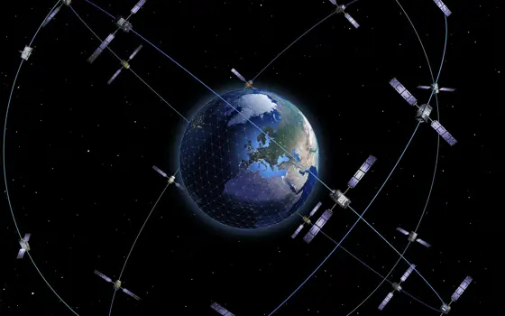 A schematic of Earth with 28 satellites orbiting in three orbital planes for the Galileo satellite navigation system.