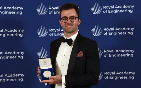 Dr Harrison Steele holding the Royal Academy of Engineering's Sir George MacFarlane Medal.