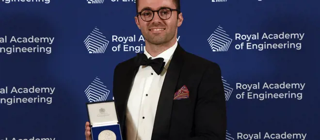 Dr Harrison Steele holding the Royal Academy of Engineering's Sir George MacFarlane Medal.