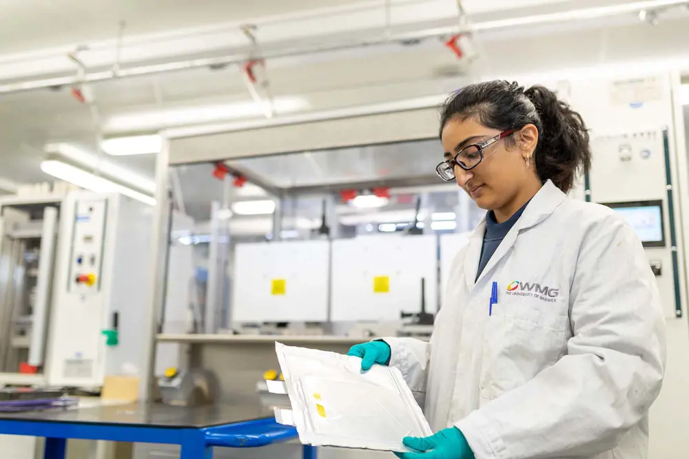 A female WMG scientist in a lab.