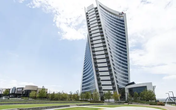 The tall, twisted PwC Tower in Johannesburg with many windows. 