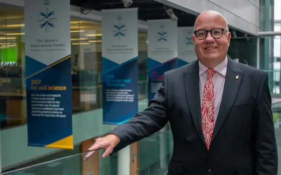 Professor Simon Pollard standing in a university research department.