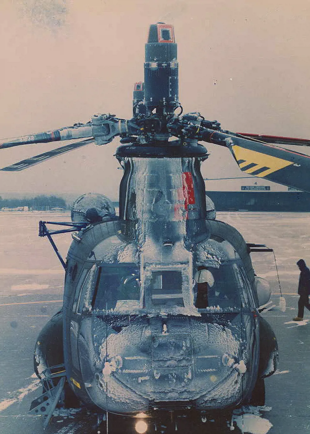 A film photograph of a Chinook helicopter, covered in ice.