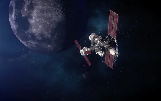 A NASA satellite floating in space, with the Moon visible behind it.