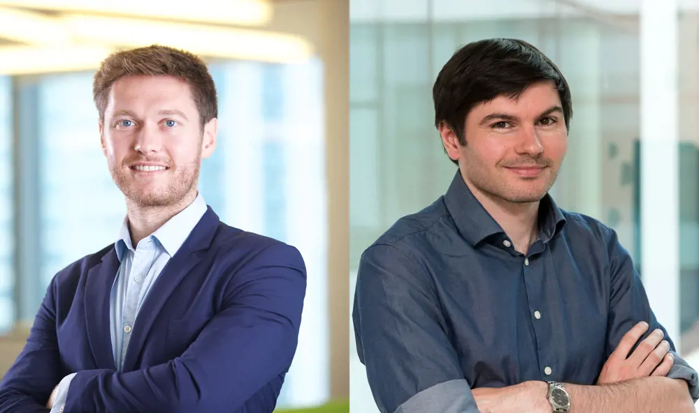 Two headshots, one of Eoin O'Loughlin (left) and the other of Philip Turner (right), who are both smiling with their arms crossed. 