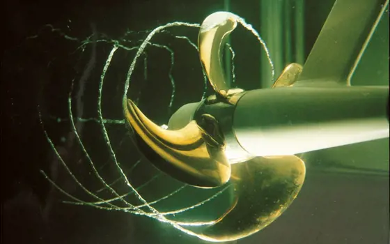 An artistic interpretation of a propeller underwater creating a vortex cavitation.