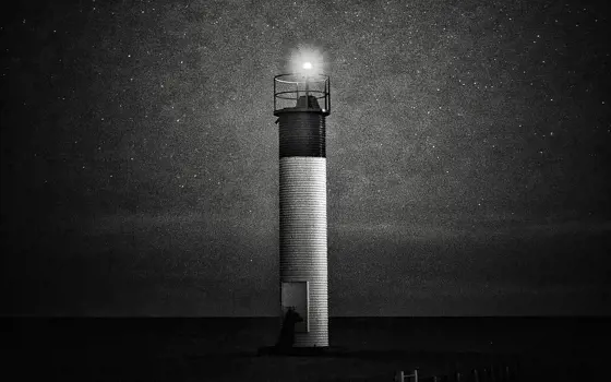 A lighthouse in the dark, resembling an illustration