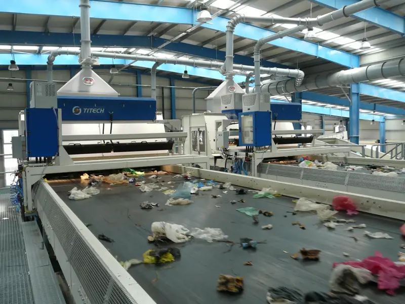 Waste on a conveyor belt being sorted by infrared separators. 