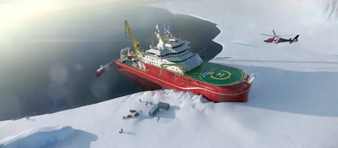 An aerial view of the RRS Sir David Attenborough breaking through ice. People and crates are seen standing on the ice and a helicopter is seen flying above the landing pad on the ship.