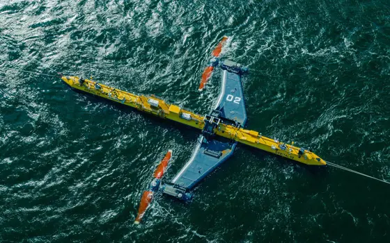 An aerial photograph of the Orbital O2 tidal turbine in the ocean.