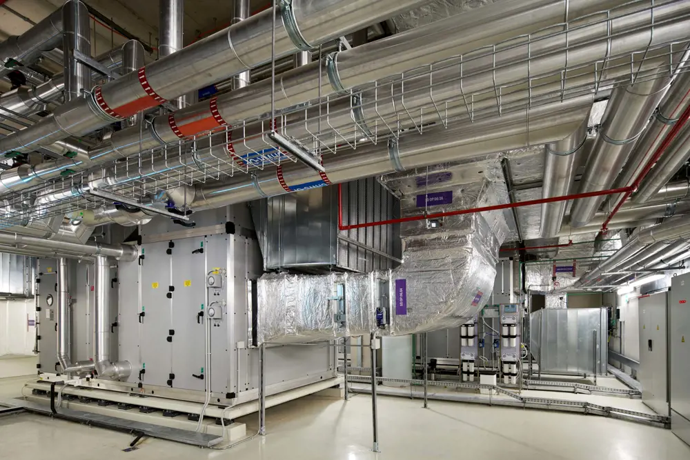 A room with pipes and equipment.