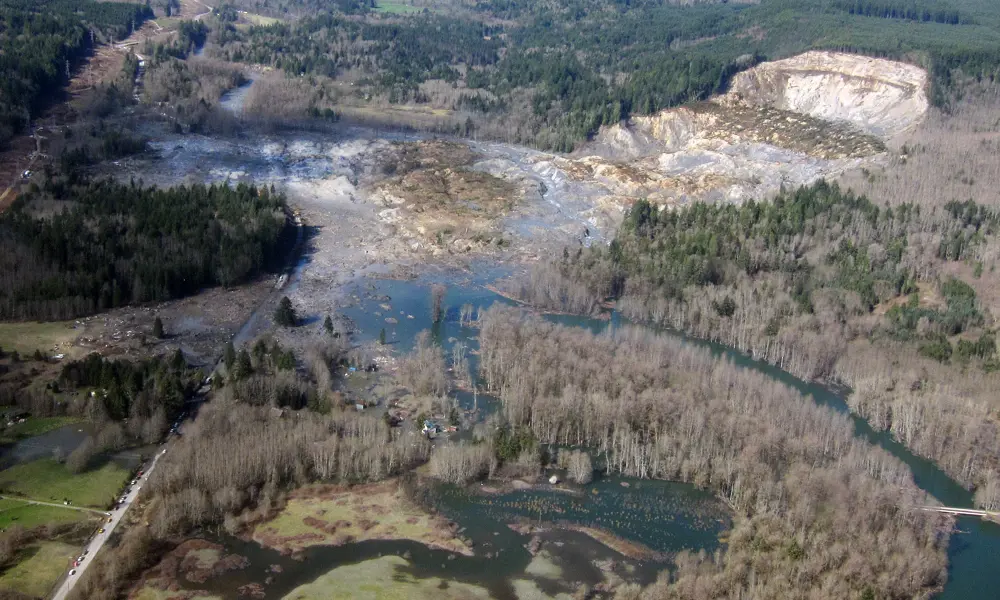 An aerial photograph of a landslide causing damage to the surrounding area.