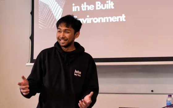 An engineering student giving a talk titled "Diversity & Inclusion in the Built Environment"