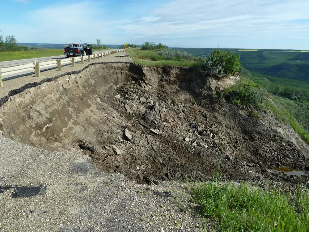 A photograph of a landslide affecting the side of a road.