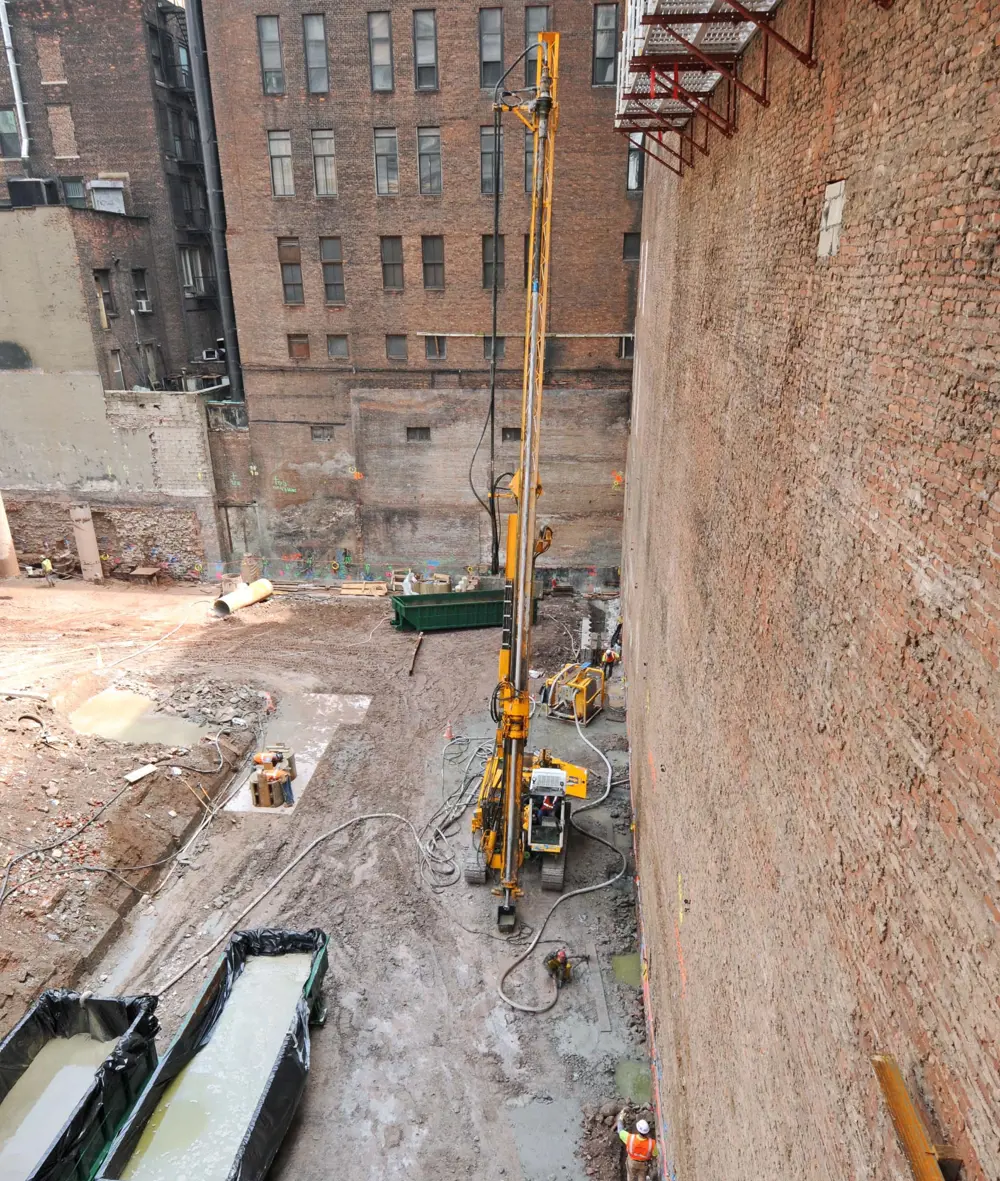A construction site, showing a jet-grouting rig by the Corbin building.