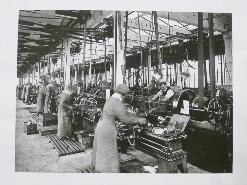 A greyscale image of women working in a factory.
