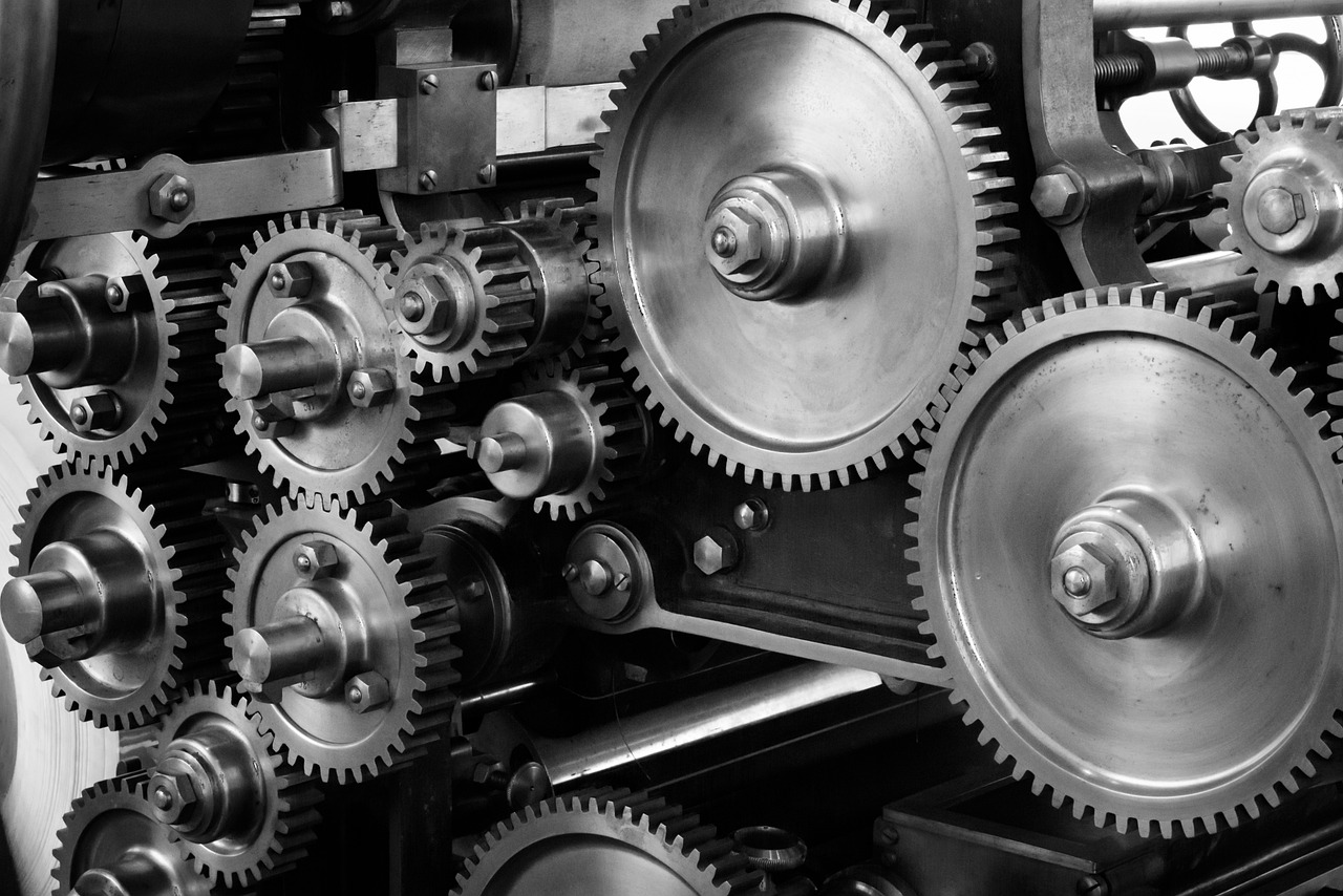 Nine cogs are shown working together