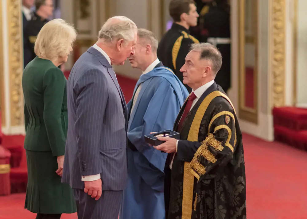 Sir Jim McDonald receiving the Queen's Anniversary Prize from His Royal Highness The Prince of Wales.