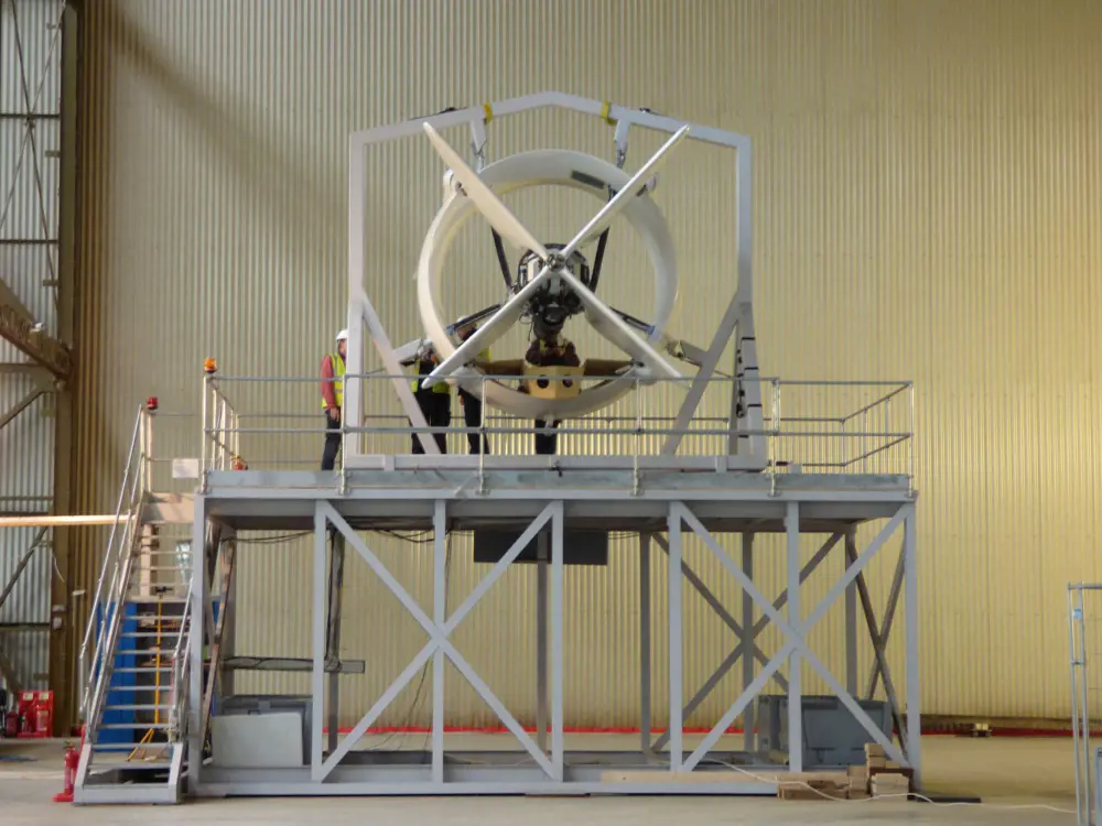 An aircraft engine on a test rig in a factory. 