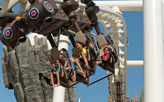 Children on the Bandit Bomber rollercoaster in Abu Dhabi.