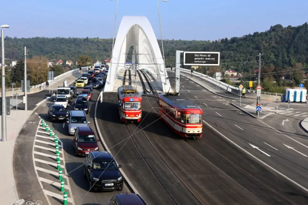 Two trams driving over Troja bridge.